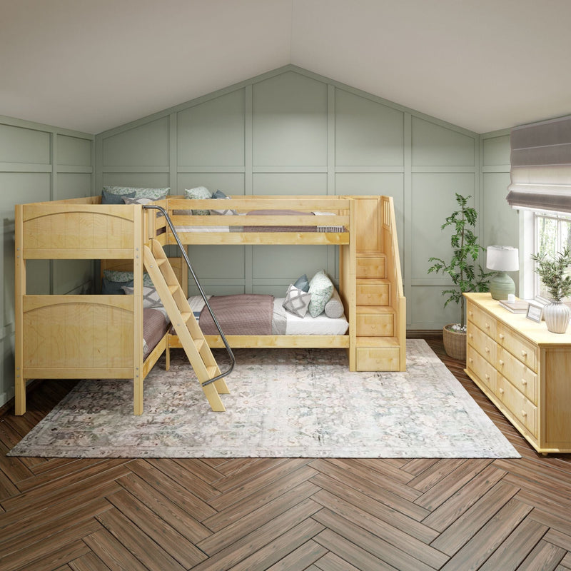 Children's bedroom with natural wood bunk beds and built-in storage stairs, sage green board-and-batten accent wall, herringbone hardwood floor, faded patterned area rug, wooden dresser, lamp and potted plant