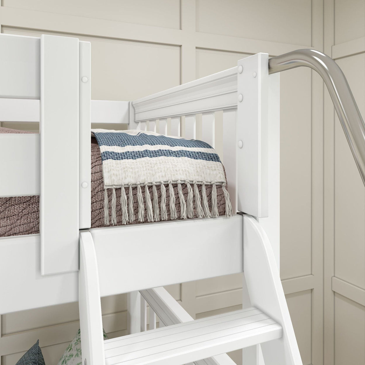 White loft bed with safety rails and a cozy blue striped blanket in a modern bedroom setting.