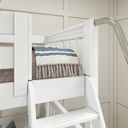 White loft bed with safety rails and a cozy blue striped blanket in a modern bedroom setting.