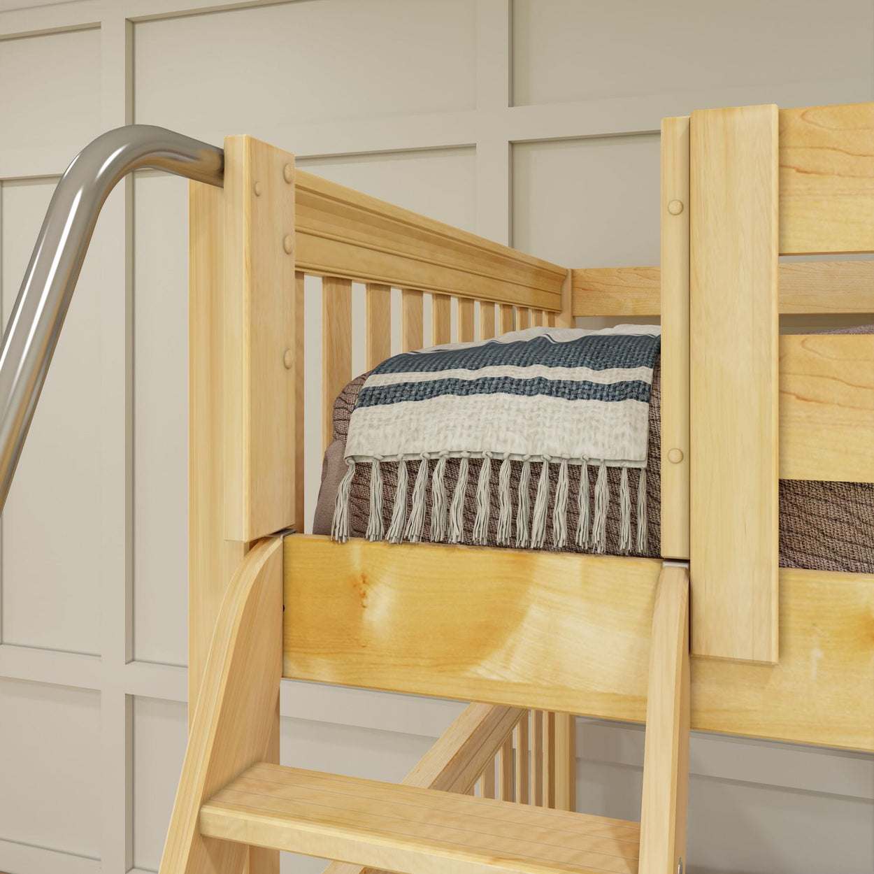 Wooden bunk bed with cozy blanket and metal slide, perfect for a stylish and functional children's bedroom.