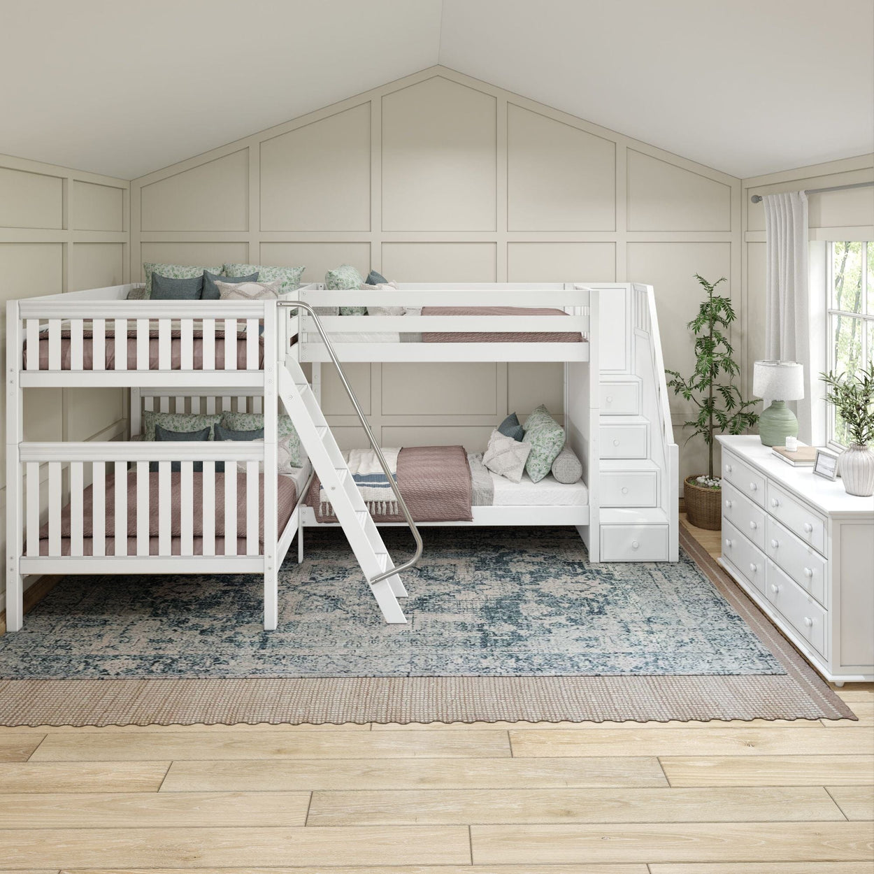 Triple bunk bed with white frame in a cozy children's room featuring pastel bedding and a rustic area rug.