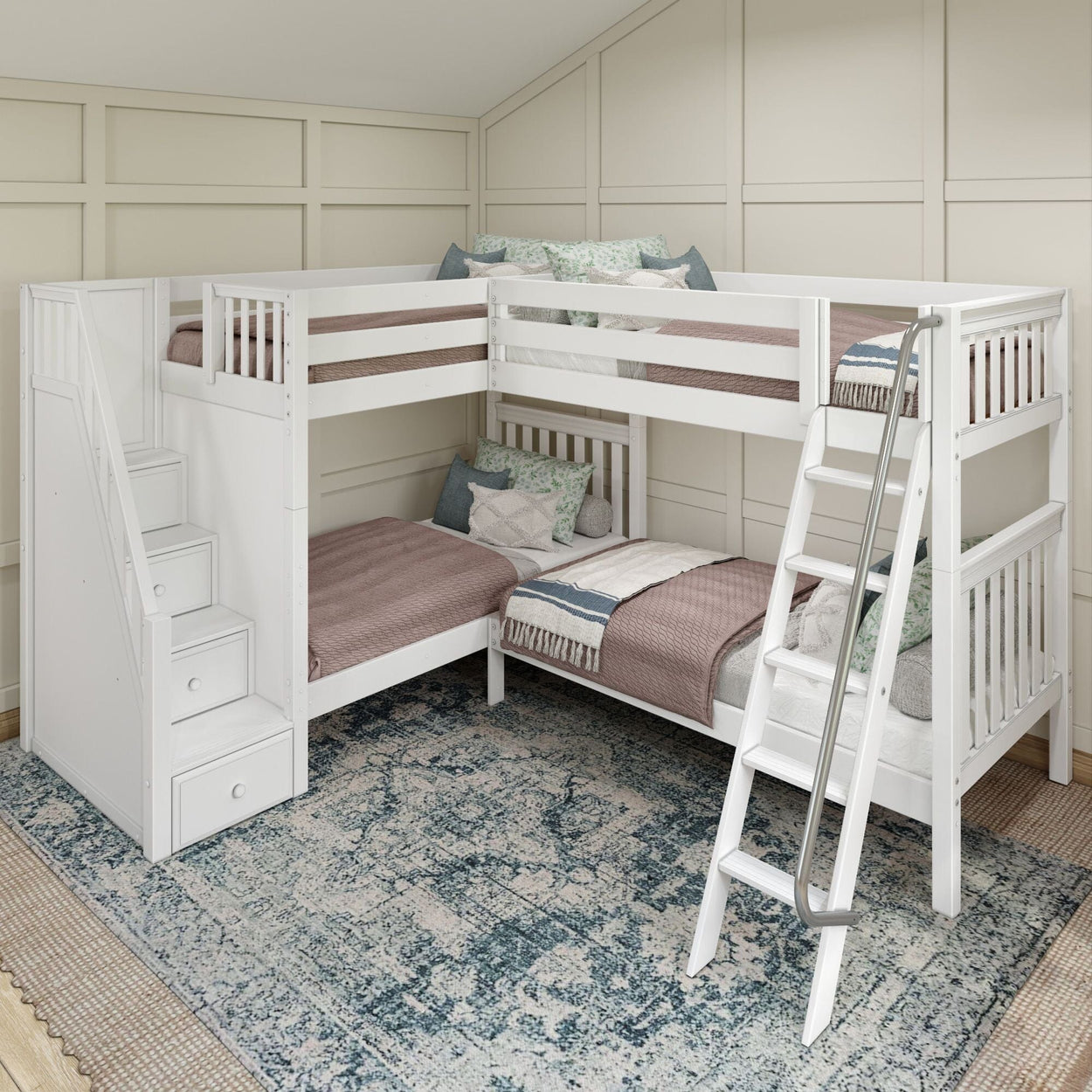 White L-shaped triple bunk bed with cozy bedding and integrated storage stairs in a modern bedroom with patterned blue rug.