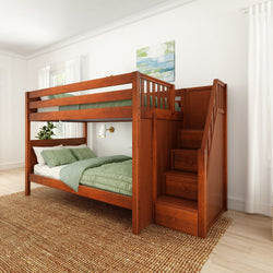 Elegant wooden bunk bed with staircase in modern bedroom featuring green bedding and natural lighting.