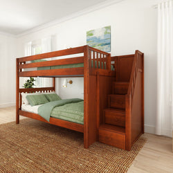Wooden bunk bed with staircase and green bedding in a bright bedroom setting.