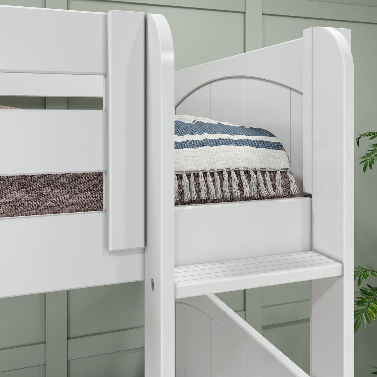 White bunk bed with brown and blue striped bedding, showcasing modern design in a cozy bedroom setting.