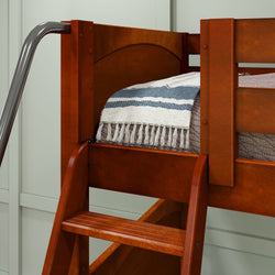 Loft bed with wooden frame, ladder, and cozy blanket in a modern bedroom.