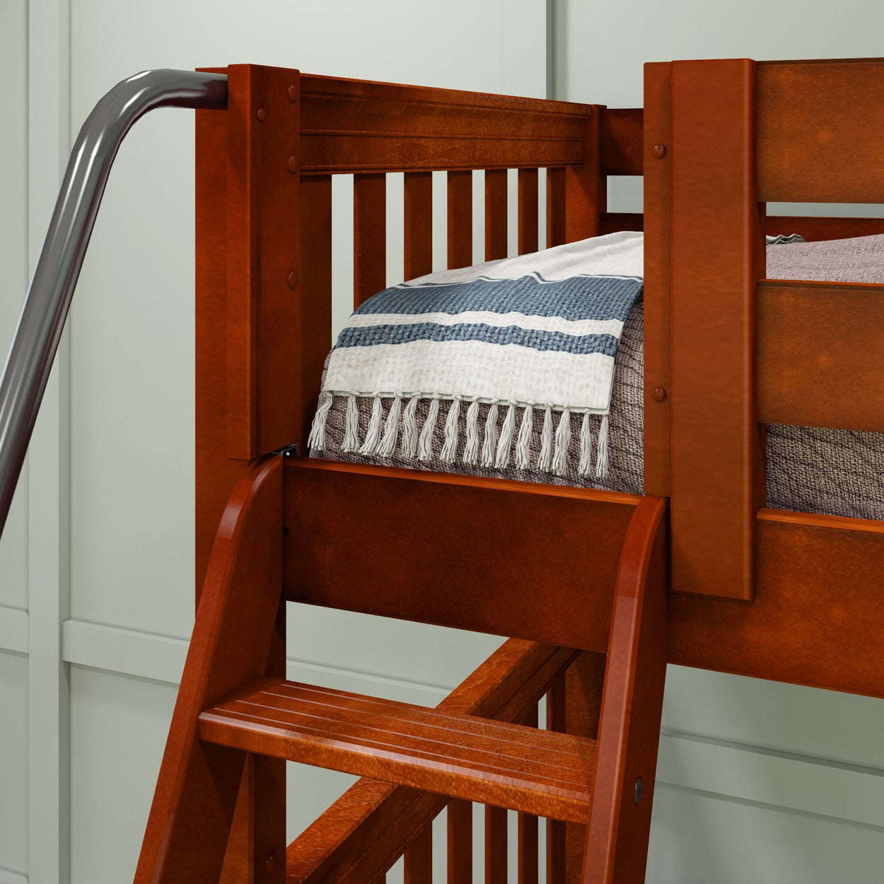 Wooden bunk bed with ladder and cozy blanket in modern bedroom design.