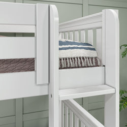 White bunk bed with cozy striped blanket detail in modern bedroom.