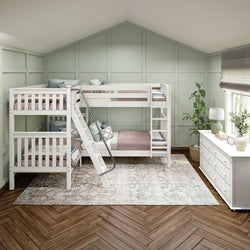 White triple bunk bed in a pastel green bedroom with wooden flooring and natural light.