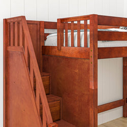 Wooden bunk bed with staircase and storage drawers in a modern bedroom setting.