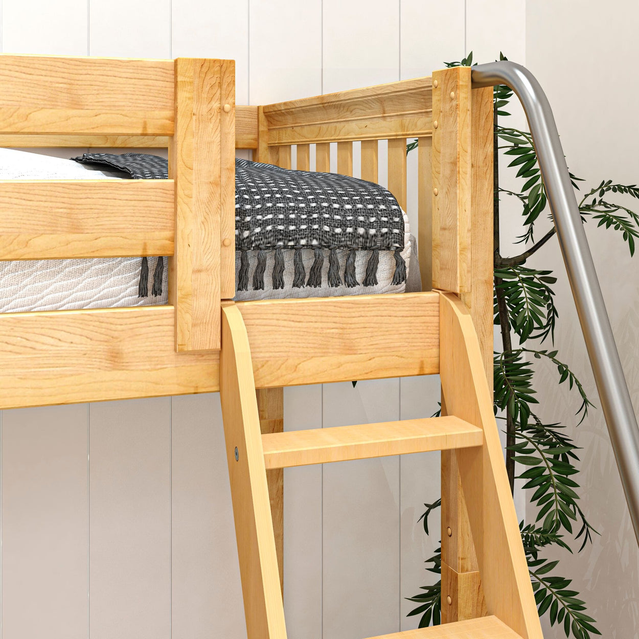 Wooden bunk bed with ladder and modern blanket in a cozy bedroom setting.