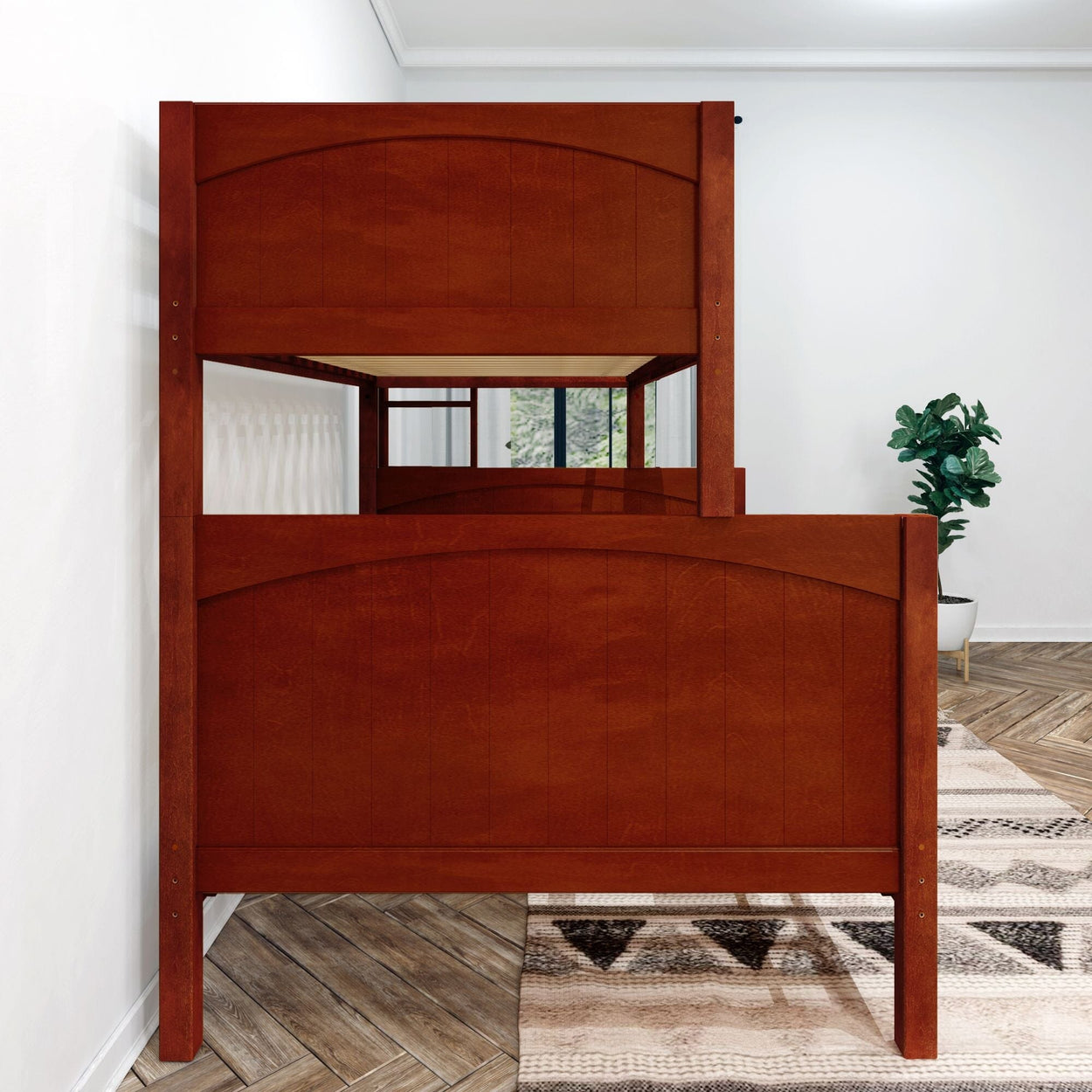 Rustic wooden bunk bed in a modern bedroom with a chevron-patterned rug and a leafy green plant.
