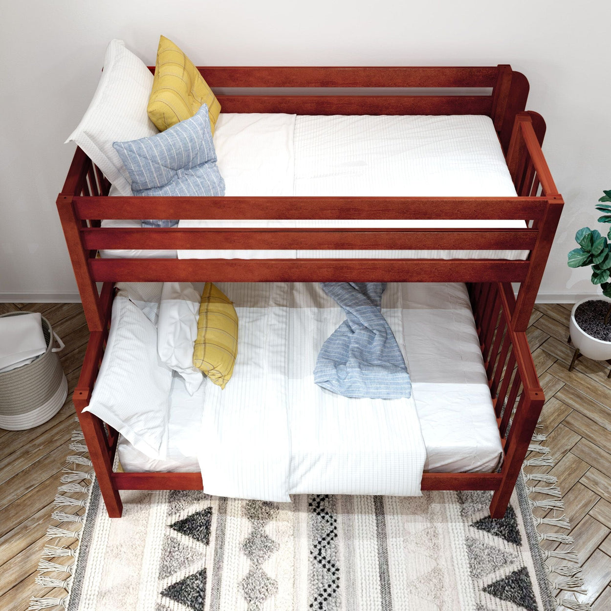 Wooden bunk bed with white and blue bedding in a cozy bedroom setting with decorative pillows and a patterned rug.