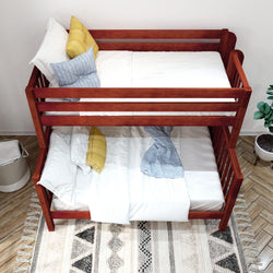 Wooden bunk bed with white and blue bedding in a cozy bedroom setting with decorative pillows and a patterned rug.