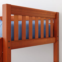 Wooden bunk bed with blue bedding and slatted safety rail.