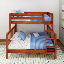 Wooden twin over full bunk bed with blue and white bedding, featuring a ladder in a modern bedroom setting.