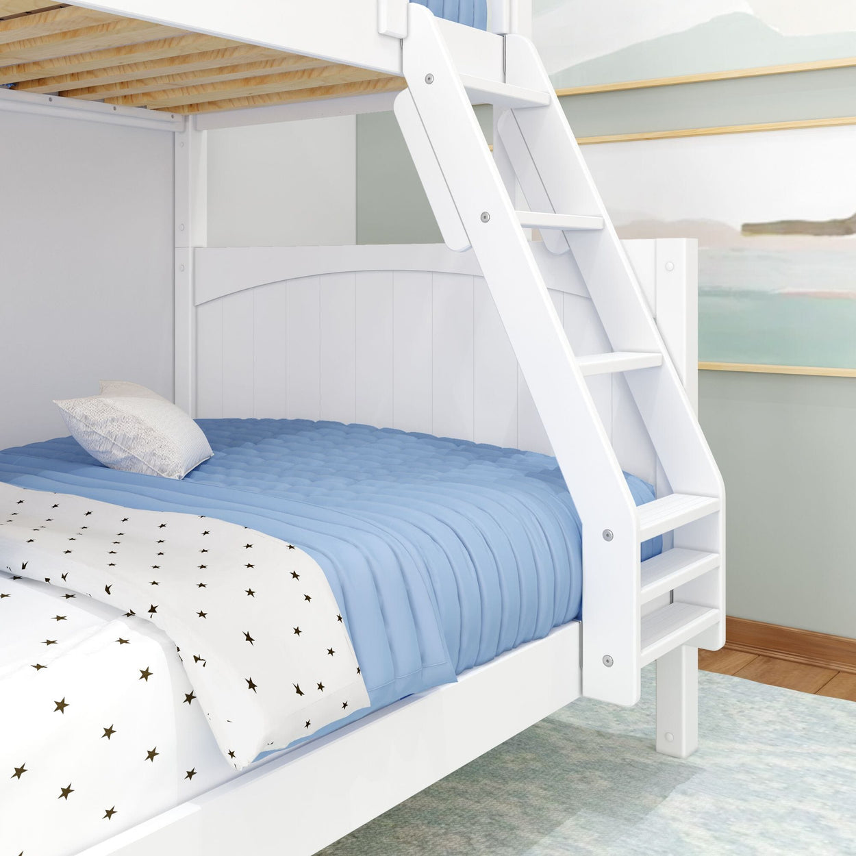 White wooden bunk bed with ladder, featuring blue bedding and star-patterned sheets in a child's bedroom.