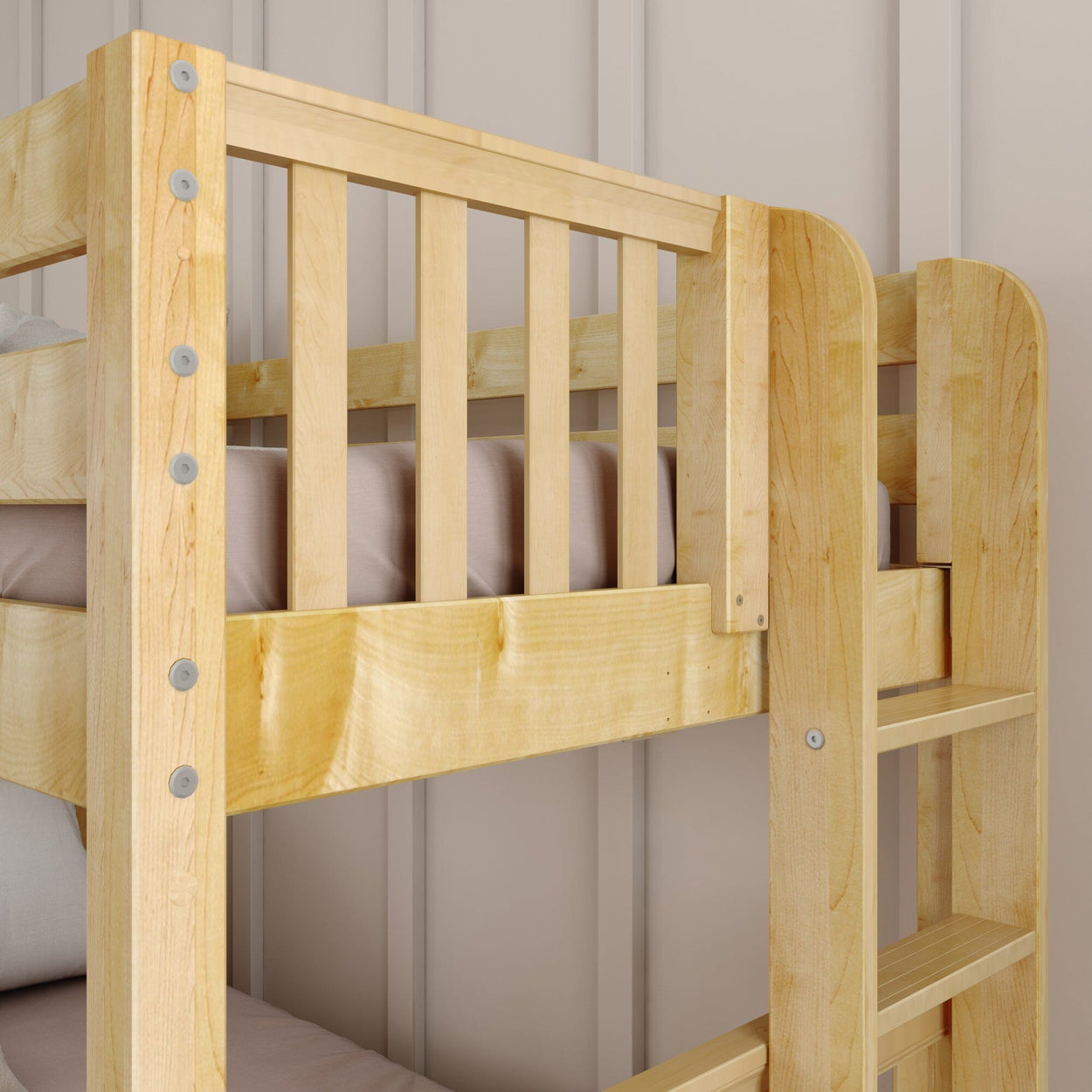 Wooden bunk bed with safety rails and integrated ladder in a modern bedroom.