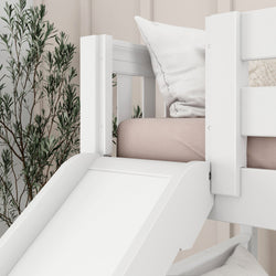 White wooden bunk bed with slide and cozy pillows in modern bedroom setting.