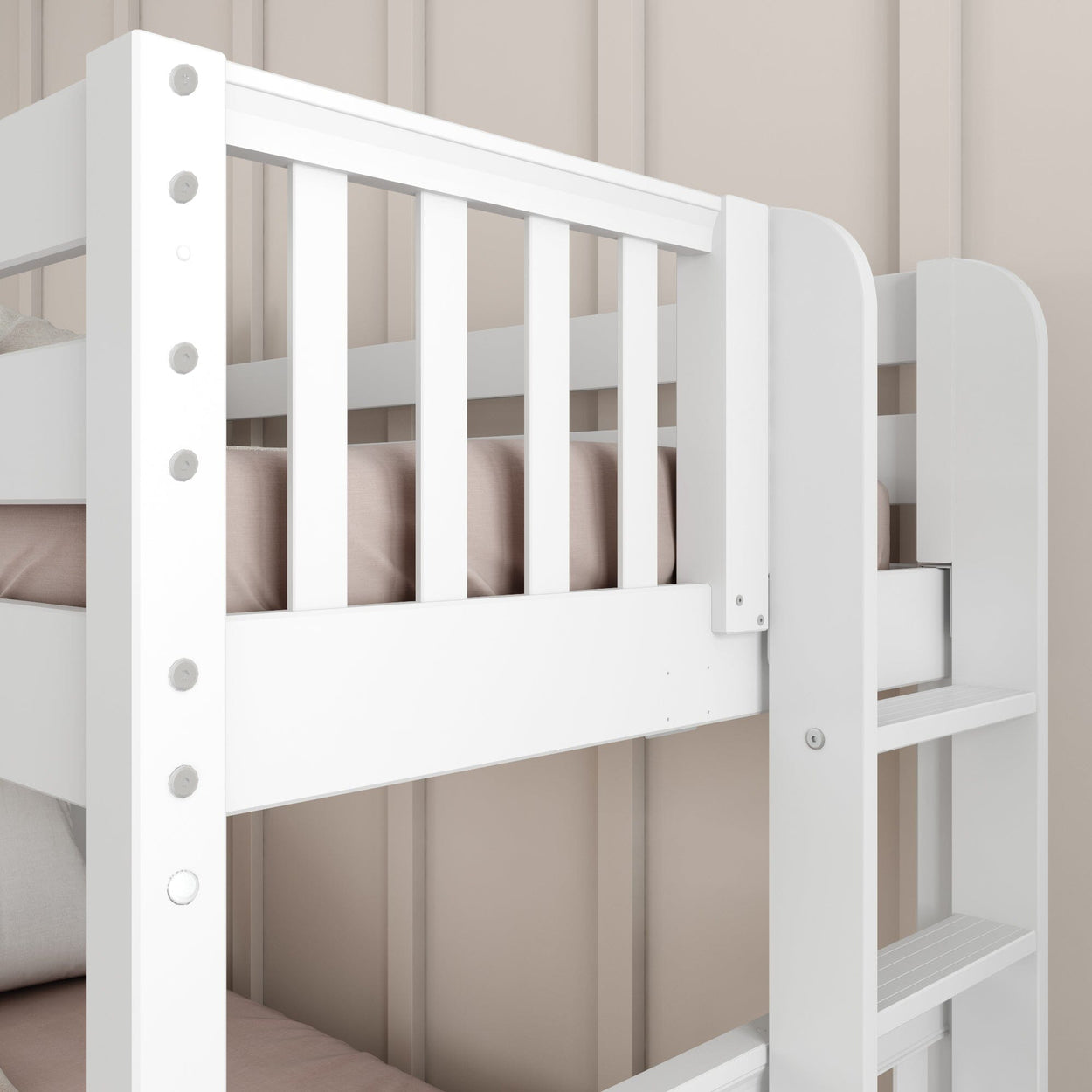 White wooden bunk bed with ladder in cozy beige bedroom setting.