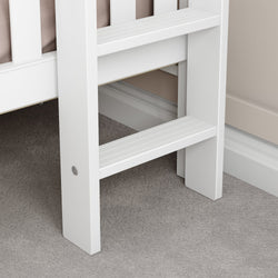 White wooden ladder close-up on carpeted floor, ideal for bunk beds or elevated spaces.