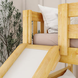 Wooden bunk bed with slide and pillows in a modern bedroom setting.