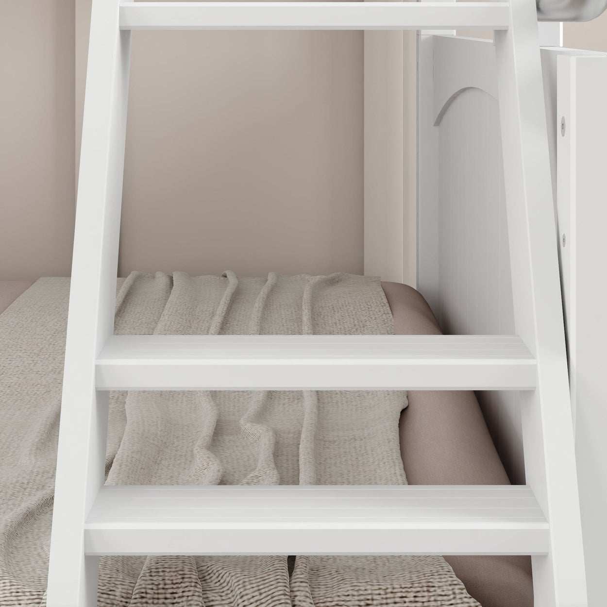 White ladder against a beige wall with a cozy blanket, interior bedroom design.