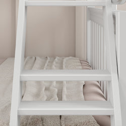 White wooden ladder next to cozy bed with neutral bedding in modern bedroom.