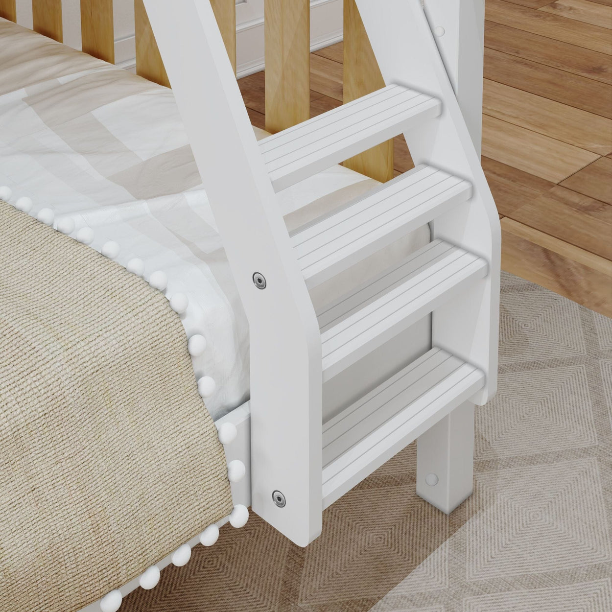 White wooden ladder attached to a cozy bunk bed with beige bedding and pom-pom accents on a wood floor.