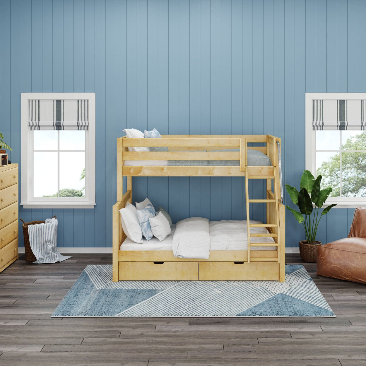 Wooden bunk bed in a cozy modern bedroom with blue walls and large windows.