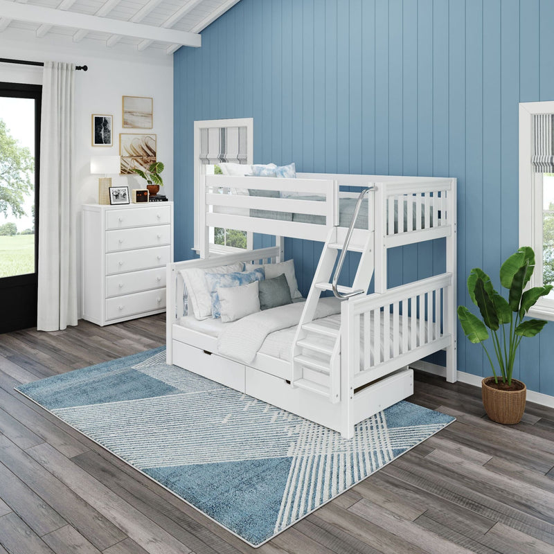 White wooden bunk bed with ladder, trundle and storage drawers in coastal blue kids' bedroom with white dresser, blue geometric rug and hardwood floor