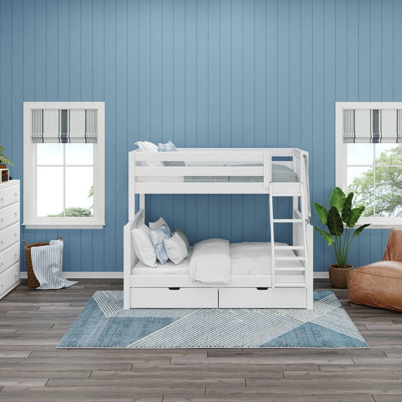 White wooden bunk bed with under-bed storage drawers and ladder in a coastal blue paneled kids' bedroom with striped rug, windows and potted plant