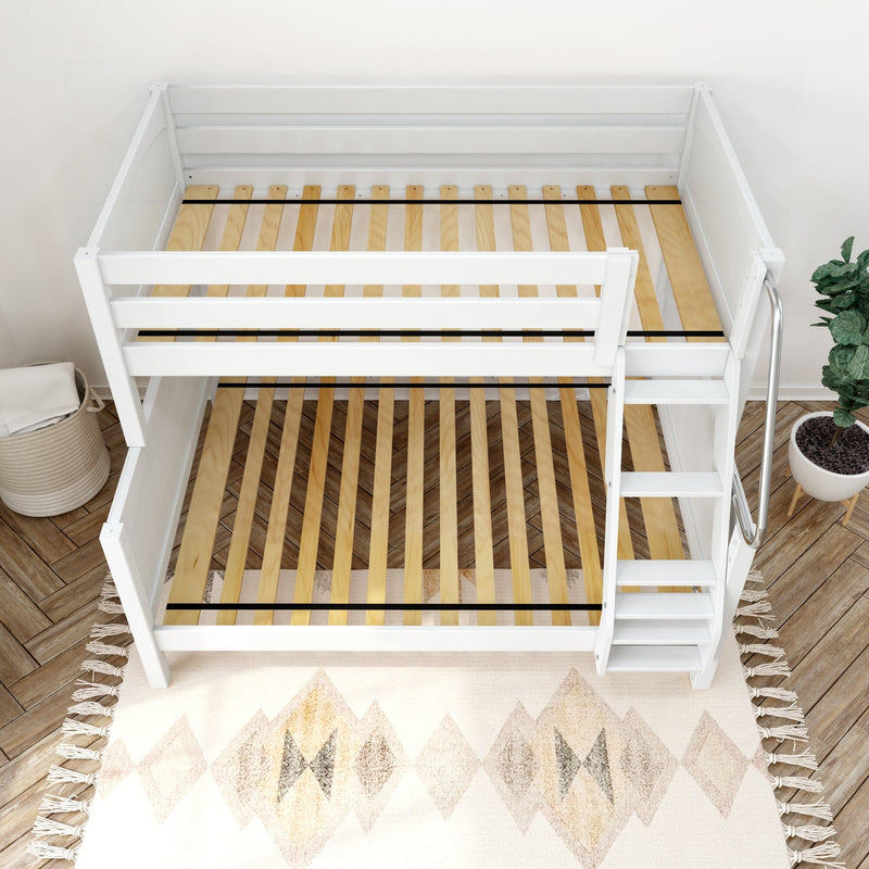 Top-down view of a white wooden loft bed frame with natural wood slats and built-in ladder in a modern kids' bedroom, decorative rug and potted plant visible