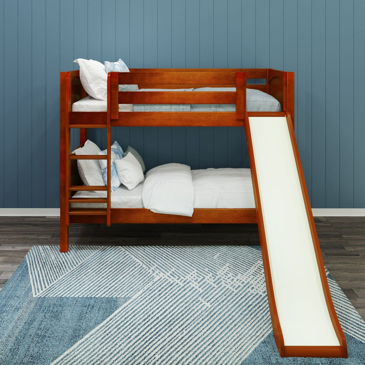 Wooden bunk bed with slide and ladder in a blue-themed child’s bedroom.