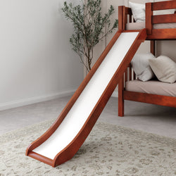 Wooden bunk bed with slide in a cozy bedroom setting, featuring soft pillows and a decorative rug.