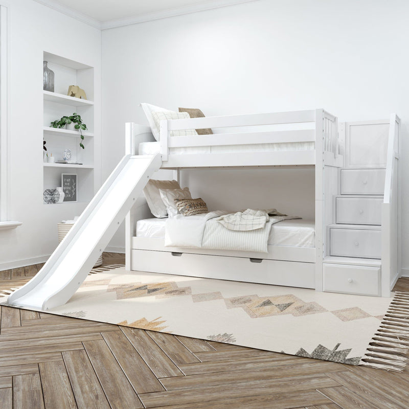 Kids' white bunk bed with slide and storage stairs in modern bedroom setting.
