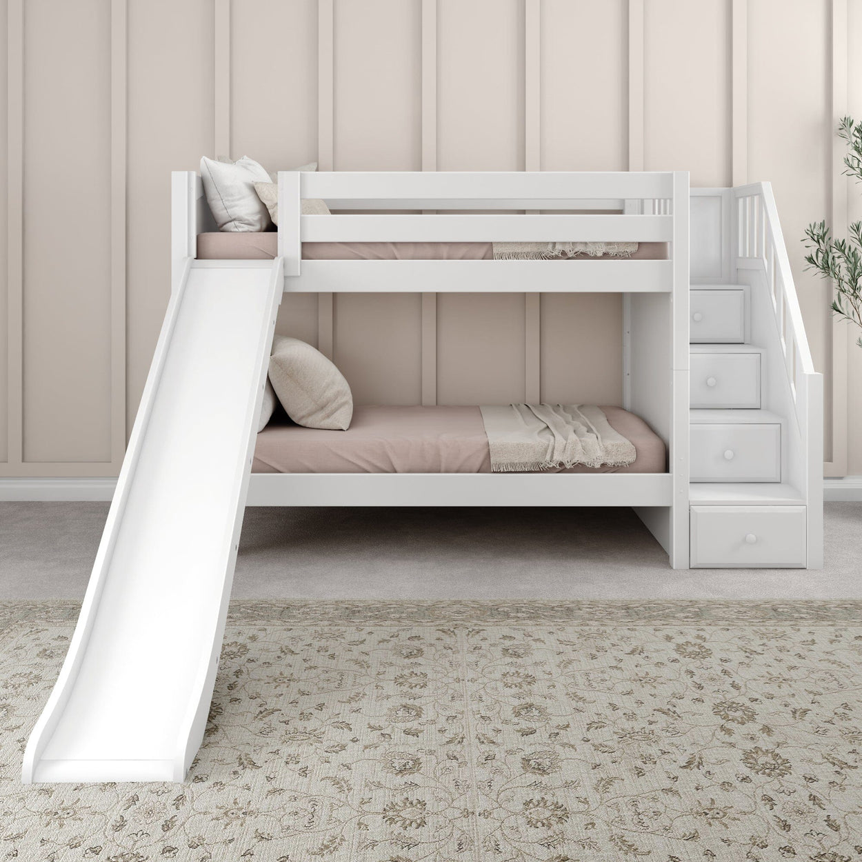 White wooden bunk bed with slide and staircase drawers in modern bedroom.