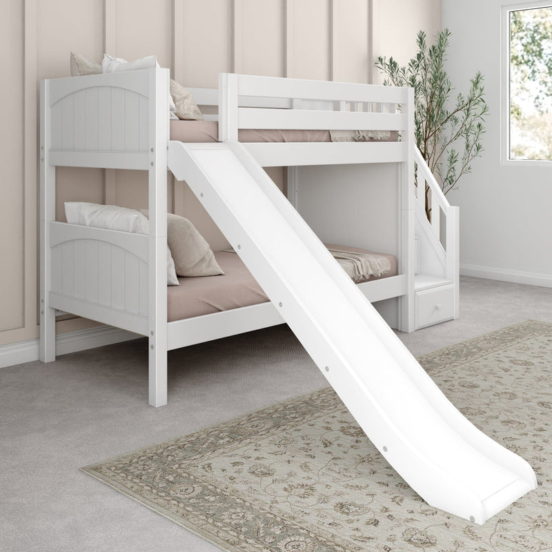 White wooden bunk bed with slide and storage stairs in modern neutral kids' bedroom with soft pink bedding