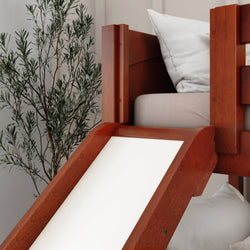 Wooden bed with slide and white cushion in a cozy bedroom setting.