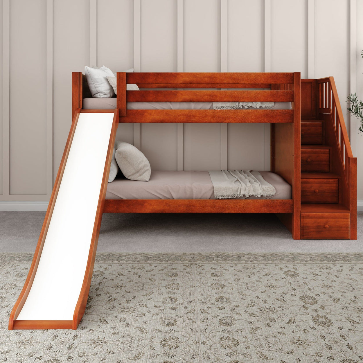 Wooden bunk bed with slide and stairs, featuring a modern design in a cozy children's bedroom.