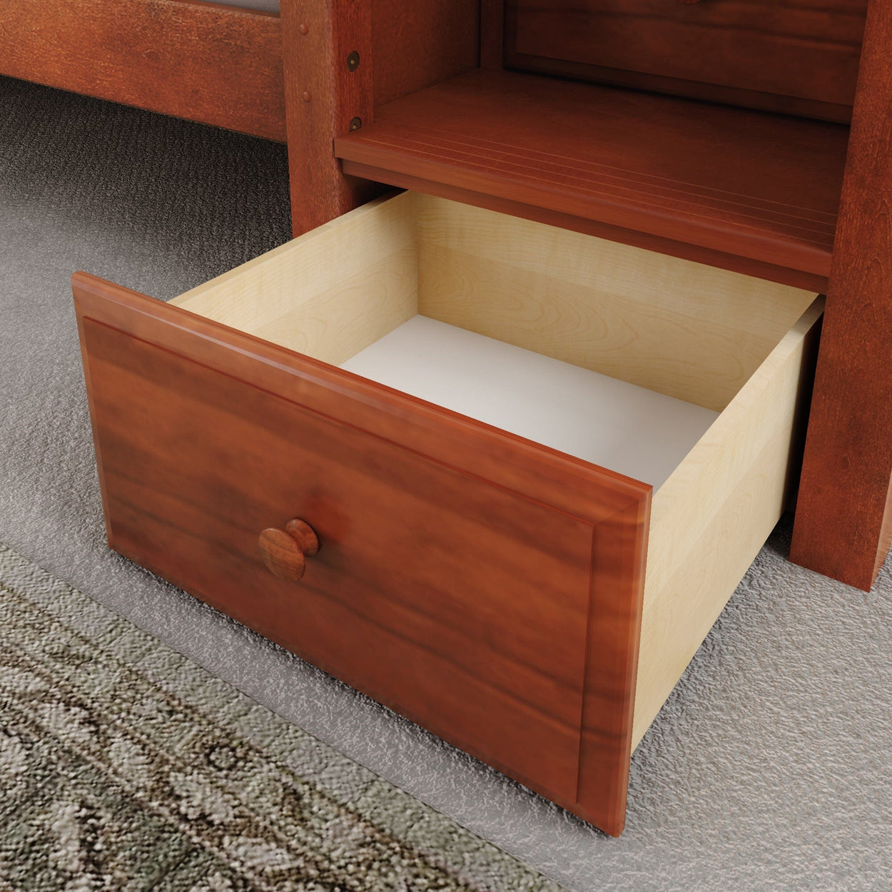 Open wooden drawer on carpeted floor, showcasing modern home storage solution.
