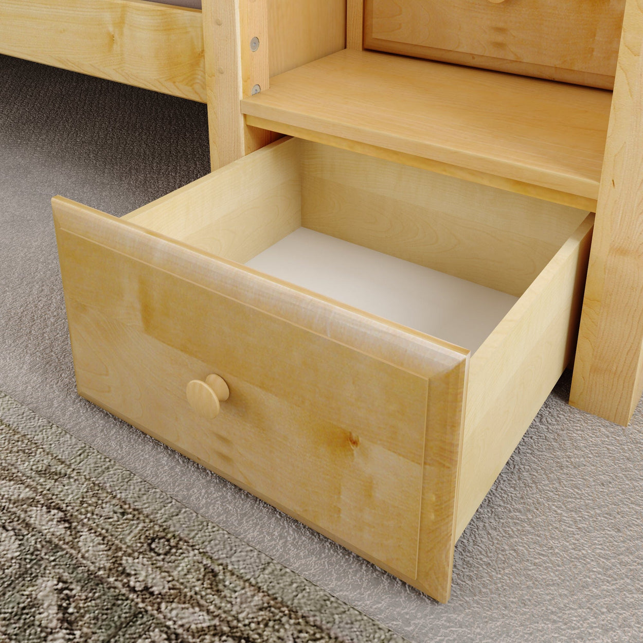 Wooden drawer on carpeted floor, pulled open for storage space display.