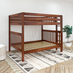 Wooden bunk bed frame in a modern bedroom with decorative rug and plant.
