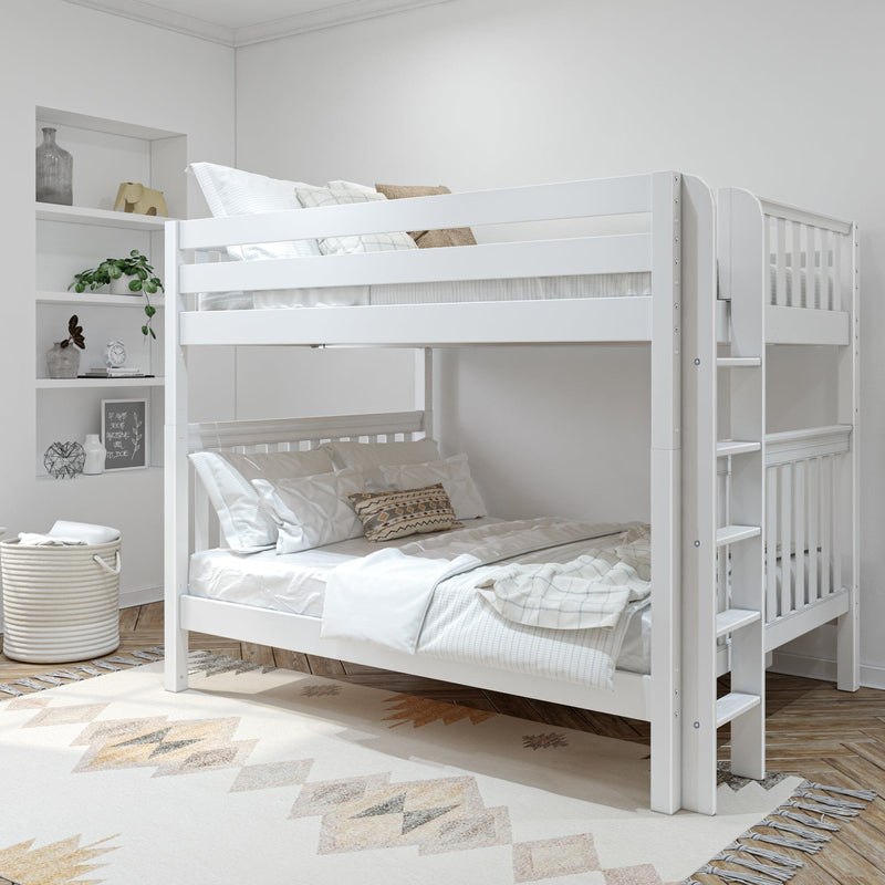 Modern white wooden bunk bed with ladder and guardrail in a neutral kids' bedroom, layered white and beige bedding, built-in shelving with decor, woven storage basket and patterned rug