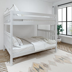 White wooden bunk beds in modern bedroom with large window and geometric rug.
