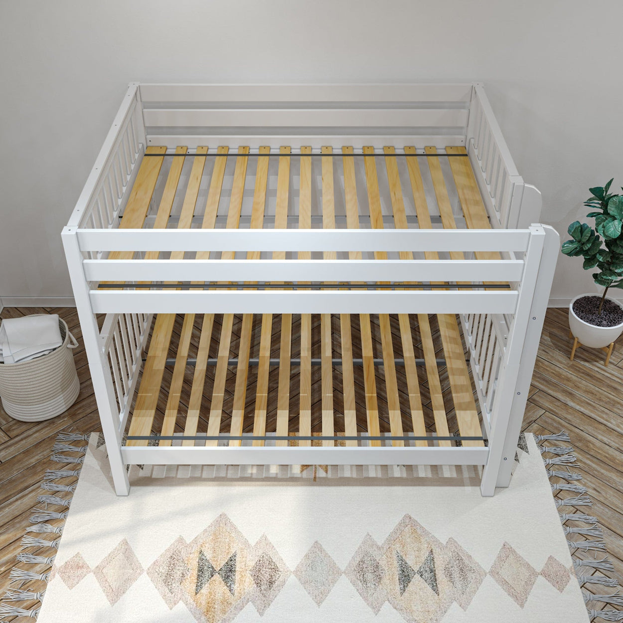 White wooden bunk bed frame with slatted base on patterned rug in a modern bedroom setting.