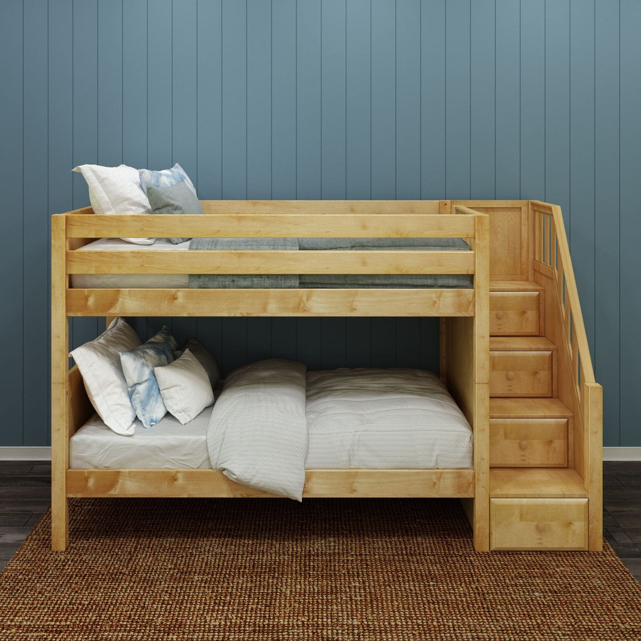 Wooden bunk bed with storage stairs in a cozy blue-walled bedroom.