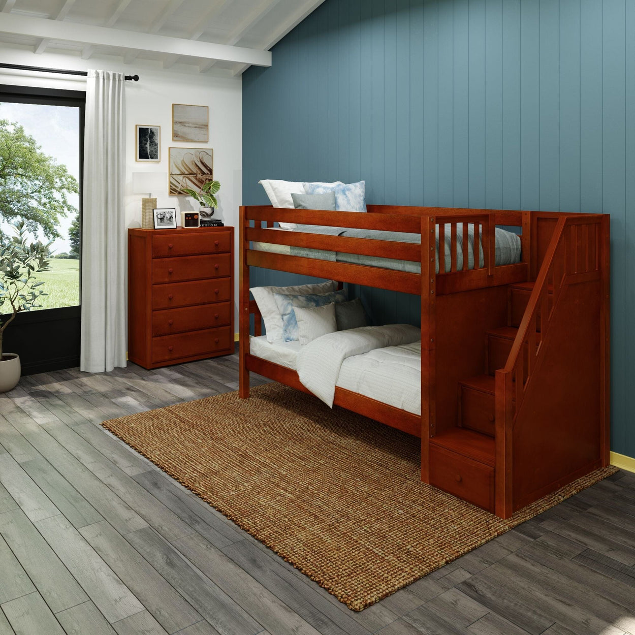 Wooden bunk bed with storage stairs in modern kids' bedroom featuring blue accent wall and natural light.