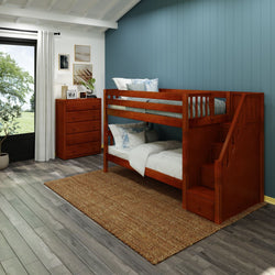 Wooden bunk bed with storage stairs in modern kids' bedroom featuring blue accent wall and natural light.