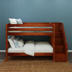 Wooden bunk bed with storage stairs in a modern bedroom featuring blue panel walls.